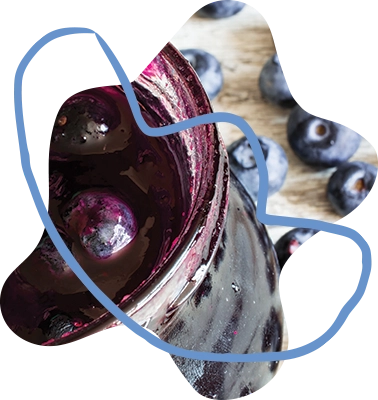 close-up photo of a jar of blueberry jam, cropped into a whimsical organic shape with a light blue crayon-inspired organic line shape overlaying it